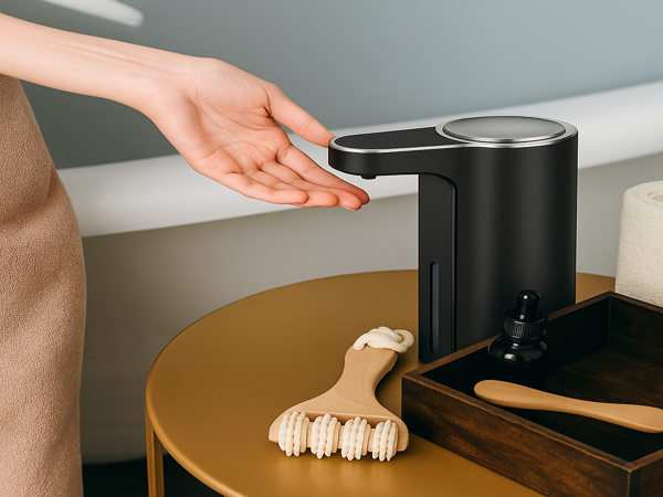 Rechargeable automatic soap dispenser releasing soap into hand – waterproof and touch-free design